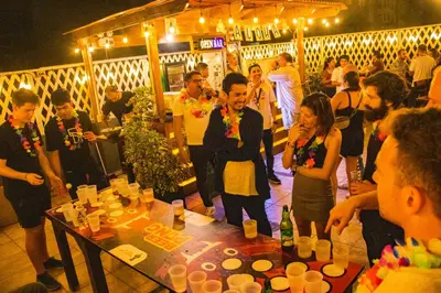 a group of people standing in a bar at PARTY HOSTEL THAY Miraflores Lima in Lima