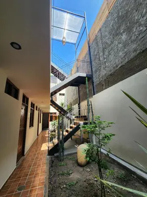 an external view of a house with a staircase at China Chancay Hotel in Chancay