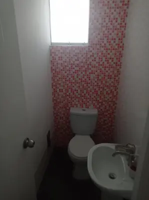 a bathroom with a toilet and a sink at Asia - Condominio Las Terrazas - departamento lindo y confortable in Islote Los Leones