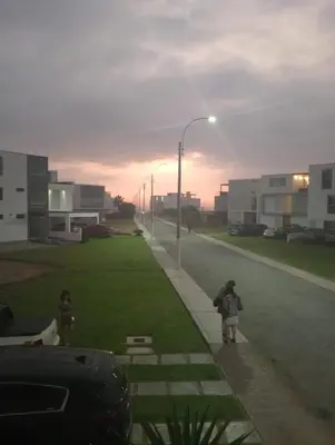 a couple of people walking down a street at Asia - Condominio Las Terrazas - departamento lindo y confortable in Islote Los Leones