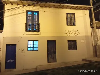 a house with graffiti on the side of it at Estancia Concepción Cusco - Peru in Cusco