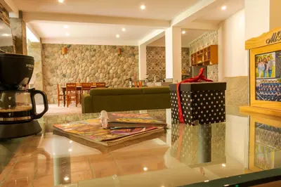 a glass table with a gift on top of it at Casa linda de Chontay junto al rio in Chontay