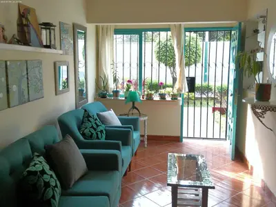 a living room with a couch and a table at Groundfloor, onebedroom apartment in Lima