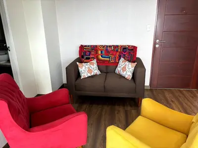 a living room with two chairs and a couch at Comfort apt in Magdalena front of supermarket! in Lima