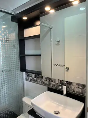 a bathroom with a sink and a toilet and a mirror at Comfort apt in Magdalena front of supermarket! in Lima