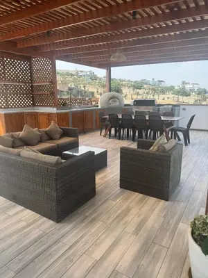 a living room with couches and a dining table at Casa de campo con vista al mar in Punta Negra