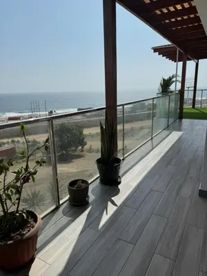a balcony with a view of the beach at Casa de campo con vista al mar in Punta Negra
