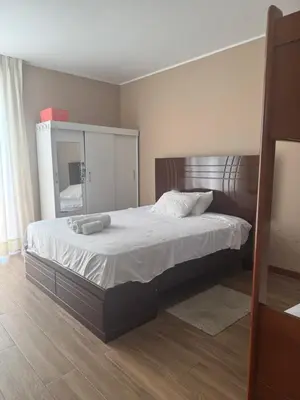 a bedroom with a large bed with a mirror at Casa de campo con vista al mar in Punta Negra