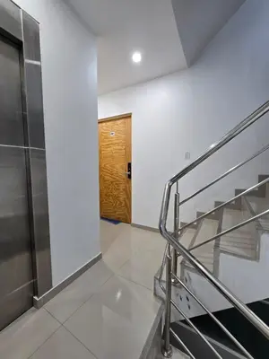 a room with a staircase and a wooden door at 402 Moderno departamento equipado in Abancay