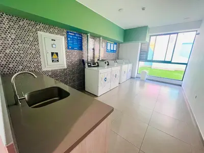 a kitchen with a sink and a counter top at The Pool & City Spot - steps from Miraflores in Lima