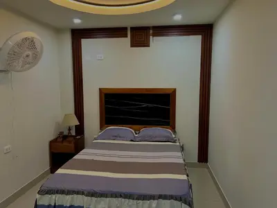 a bedroom with a bed and a fan at Habitación premium y moderna in La Merced