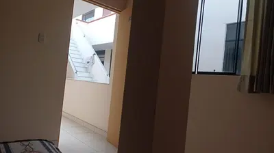 an empty room with a staircase and a window at Hotel Perseo Inn in Barranca