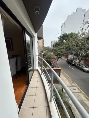 a balcony of a building with a view of a street at Comfort and family exclusivity in Lima