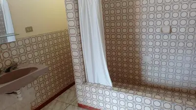 a bathroom with a shower and a sink at Hotel Perseo Inn in Barranca