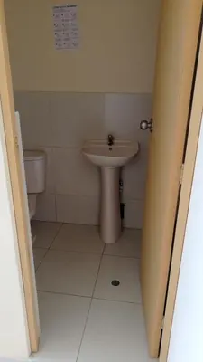 a bathroom with a sink and a toilet at Hotel Perseo Inn in Barranca