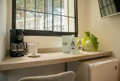 a counter with a coffee maker and a window at Casa la Paz by Wynwood House in Lima