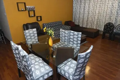 a living room with a table and chairs and a couch at Great Location near to everything! in Lima