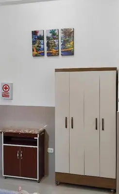 a room with two white cabinets and a desk at ideal depa lujo con cocina wifi in Puente Piedra