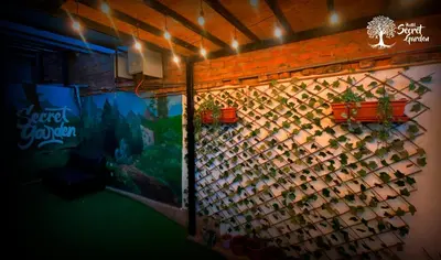 a wall with a bunch of wine bottles at Taytacha House in Cusco