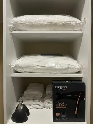 a closet with a shelf with a bed and a box at Premium apartment with AC Miraflores in Lima