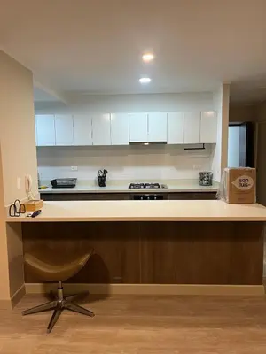 a kitchen with a counter and a chair in a room at Premium apartment with AC Miraflores in Lima