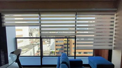 a living room with a large window with blinds at Apartment in Miraflores - Lima in Lima