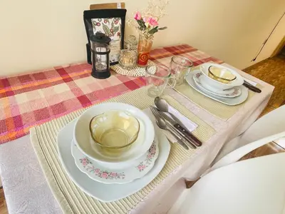 a table with two plates and a cup of coffee at Luminoso minidepartamento independiente cerca al Estadio Nacional in Lima