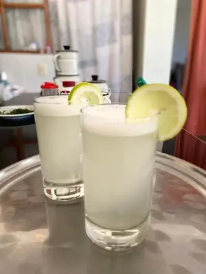 two glasses of water with a lemon slice on a tray at Eco Lodge Elegant Qollpawasi in Colcapampa