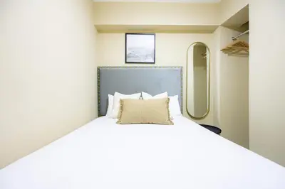 a bedroom with a bed in a train at ALU Apartments - Ocean View at Larcomar Miraflores Next to JW Marriott in Lima