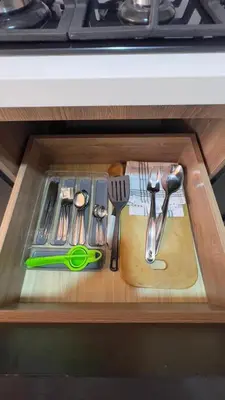 a drawer with some utensils on a cutting board at Miraflores Deluxe in Lima