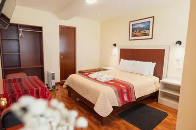 a hotel room with a bed in a room at Hotel Casa Suite Inka in Ollantaytambo