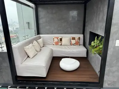 a living room with a white couch and a table at BR1 Barranco Exclusive Department in Lima