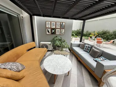 a living room with a couch and a table at BR1 Barranco Exclusive Department in Lima