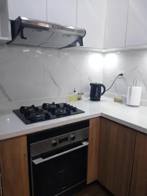 a kitchen with a stove top oven in a kitchen at Apartamento 3D de estreno muy céntrico in Lima