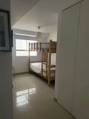 a room with a bunk bed and a window at Beautiful apartment with an ocean view in San Bartolo