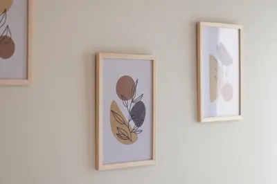 three framed prints of flowers on a wall at Cozy apartment in Barranco in Lima