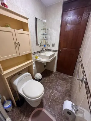 a bathroom with a toilet and a sink at Departamento in Lima