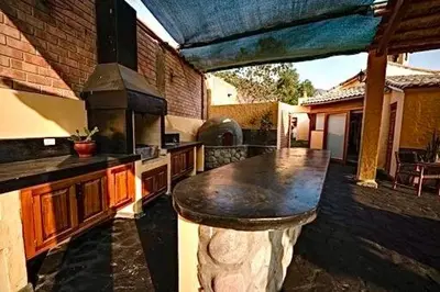 a kitchen with a large island in the middle at Casa Trasgu en Cieneguilla Lima Peru Nice and cozy cottage in Villa María del Trunfo