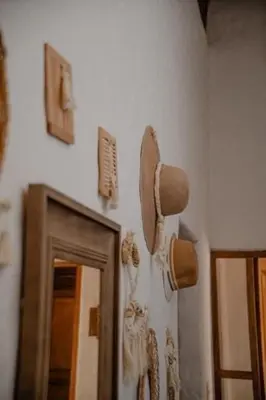 a pair of shoes hanging on a wall at Casa Trasgu en Cieneguilla Lima Peru Nice and cozy cottage in Villa María del Trunfo