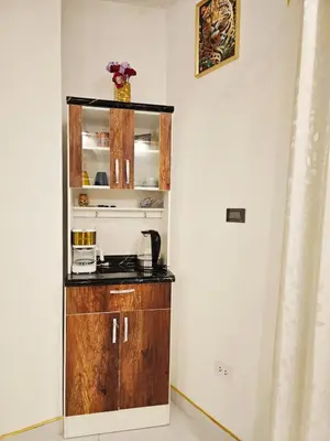 a kitchen with a sink and a cabinet in a room at Familiar Premium Twin Chanchamayo in La Merced