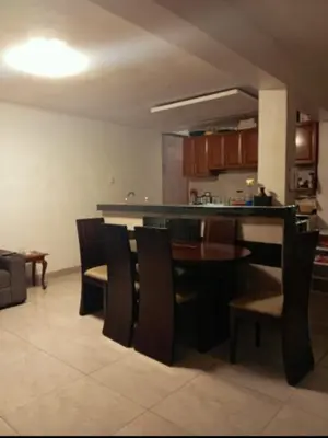 a kitchen and dining room with a table and chairs at Colibri - Hab Triple in Lima
