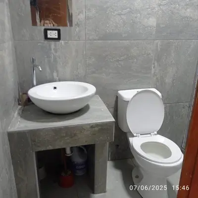 a bathroom with a sink and a toilet at Colibri - Hab Triple in Lima