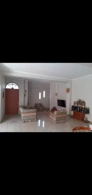a living room with two couches and a tv at Noah'house in Nazca