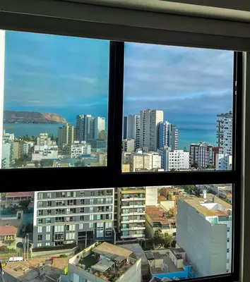 a view of a city from a window at Ocean view 1 BR Miraflores with parking in Lima