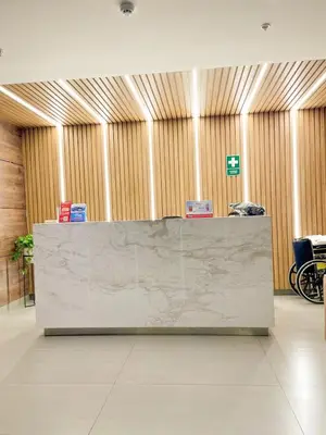 a lobby with a reception desk with a marble counter top at Ocean view 1 BR Miraflores with parking in Lima