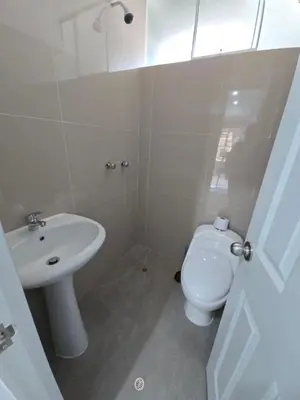 a bathroom with a white toilet and a sink at 501 Modern equipped department 3 in Abancay