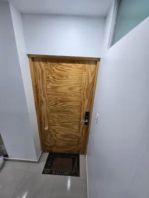 a wooden door in the middle of a room at 501 Modern equipped department 3 in Abancay