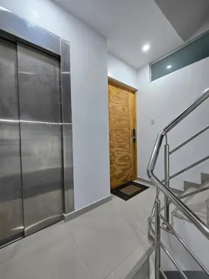 a bathroom with a metal door and a staircase at 501 Modern equipped department 3 in Abancay