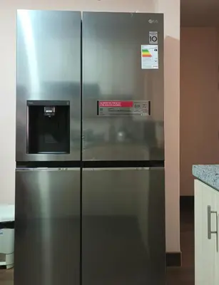 a stainless steel refrigerator in a kitchen at Katty's apartment - Las Malvas in Lima