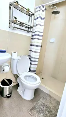 a bathroom with a toilet and a shower at Suite Ocean View con WiFi San Miguel 1502 in Lima